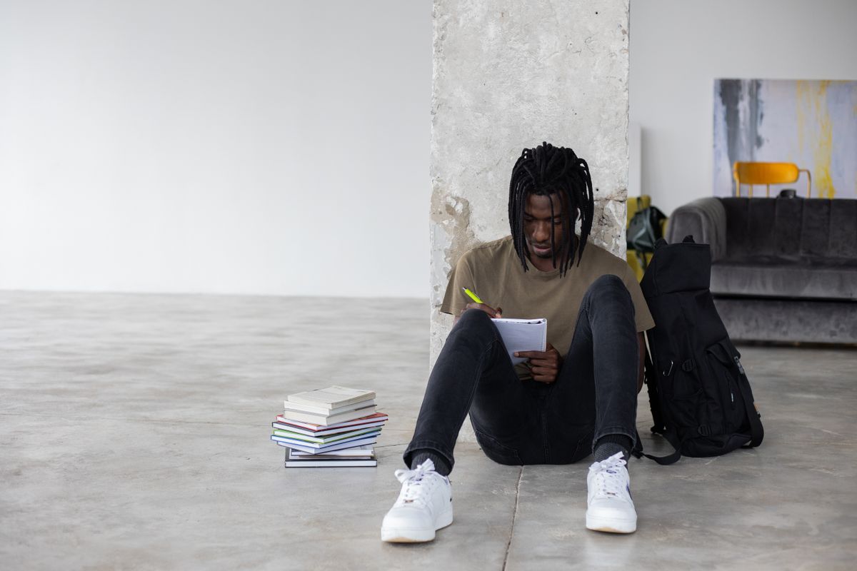 A student writing in a notebook