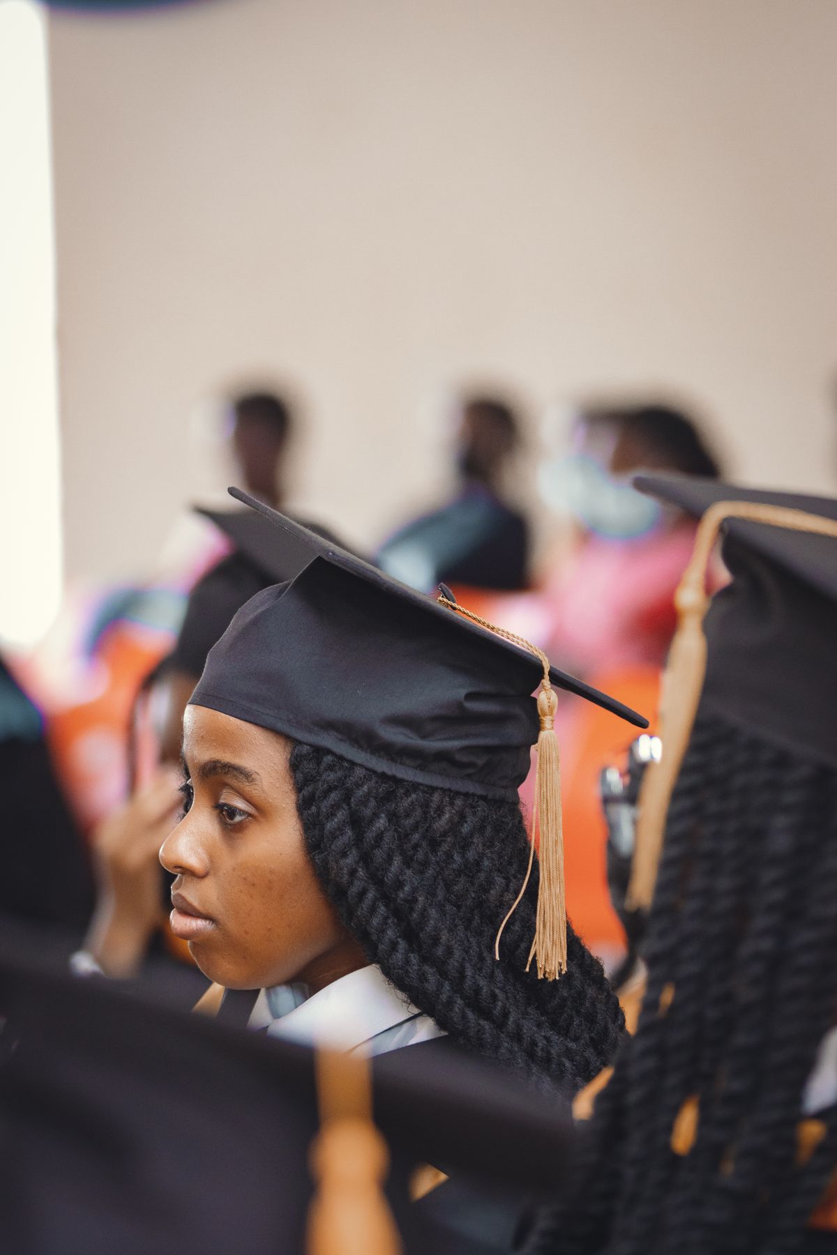 A graduate in cap and gown at commencement